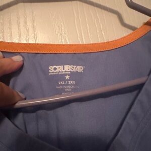 Two scrub tops 1 Scrubstar 1 WonderFlex